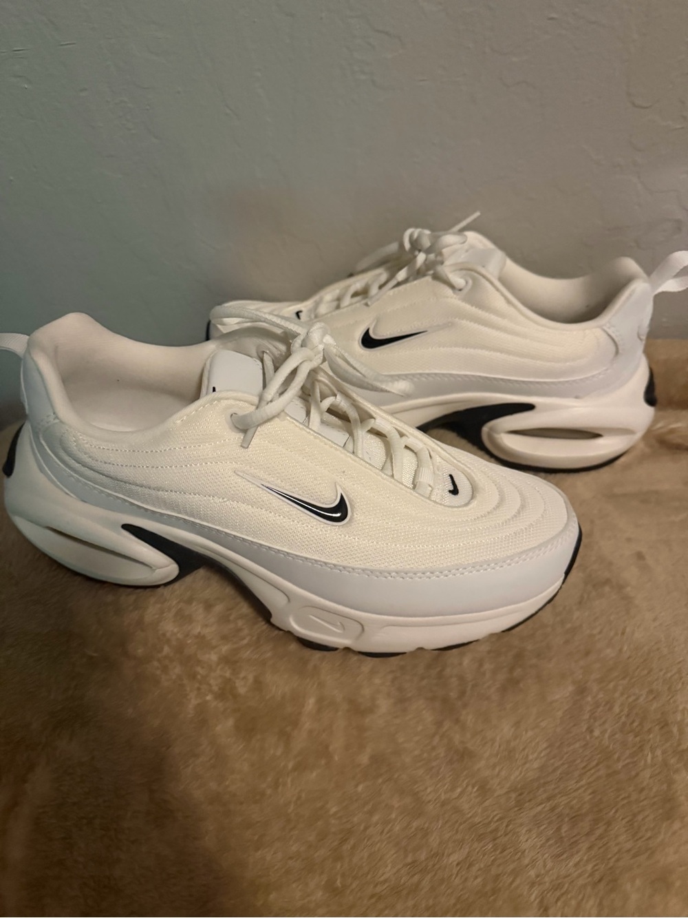 Nike White Sneakers with Black Swoosh Accents